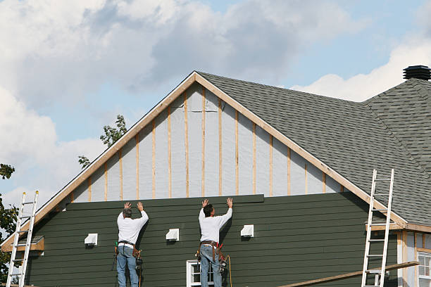 Professional Storm Damage Siding Repair technician working in Dayton, PA